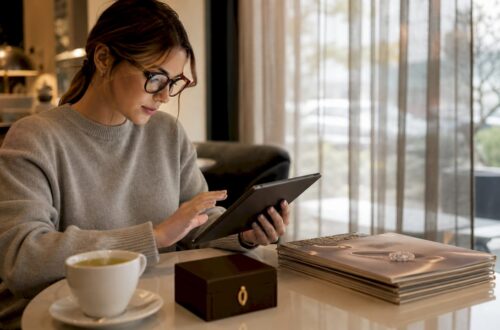 Woman browsing engagement ring alternatives on tablet