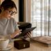 Woman browsing engagement ring alternatives on tablet
