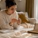 Woman selecting personalized jewelry options at table