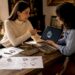 Jewelry designer consulting client on custom design