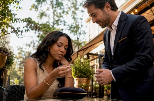 Customer examining conflict-free diamond ring in boutique
