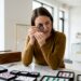 Jeweler examining gemstone on workbench