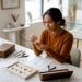 Woman inspecting handcrafted custom jewelry pieces in studio