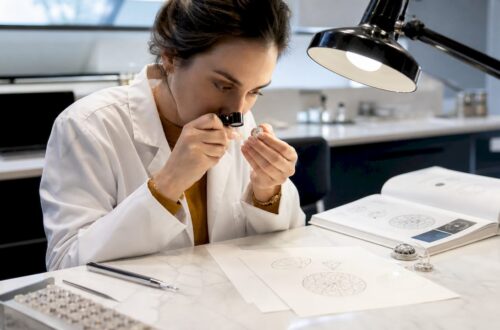 Gemologist examining a diamond with loupe