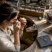 Jeweler inspecting a ring prototype in workshop