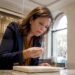 Customer examining diamond ring in jewelry store