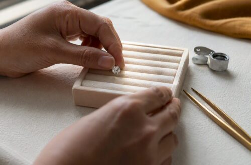 Hands placing lab-grown diamond on tray