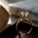 Cathedral ring setting showing elevated diamond and metal arches