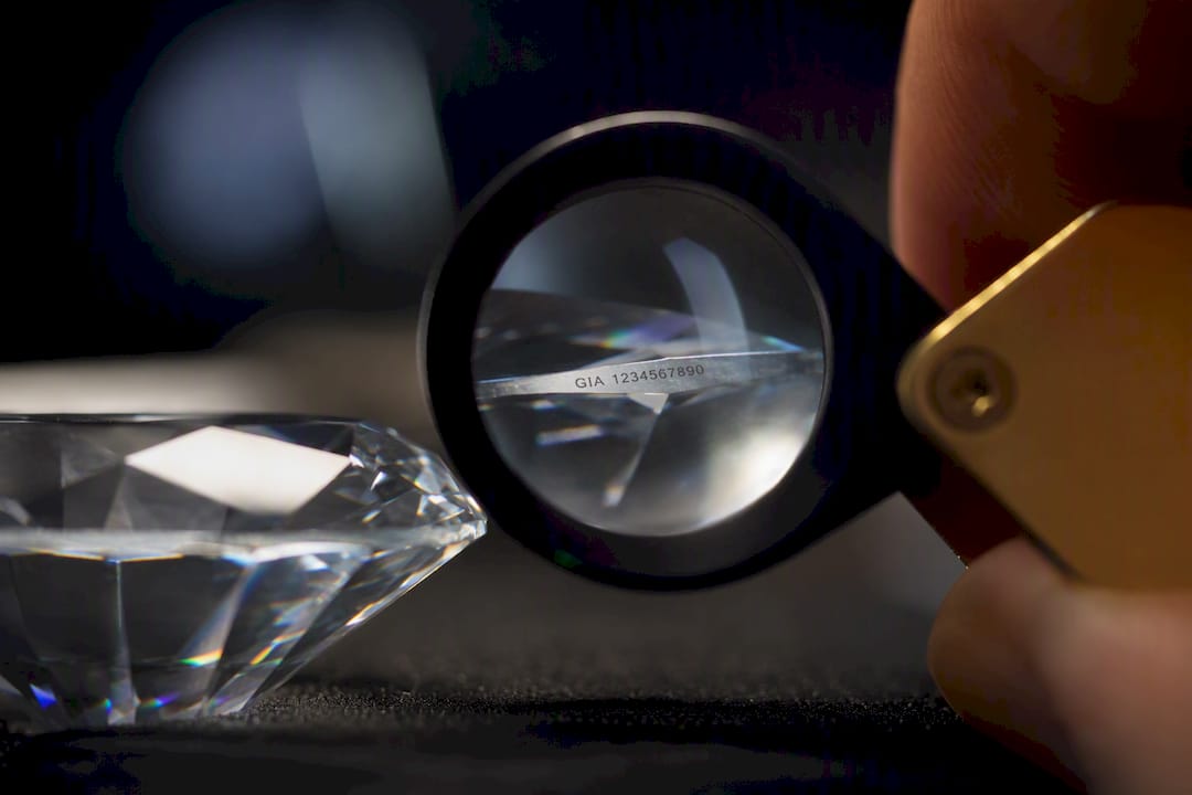 Diamond girdle viewed through a jeweler’s loupe