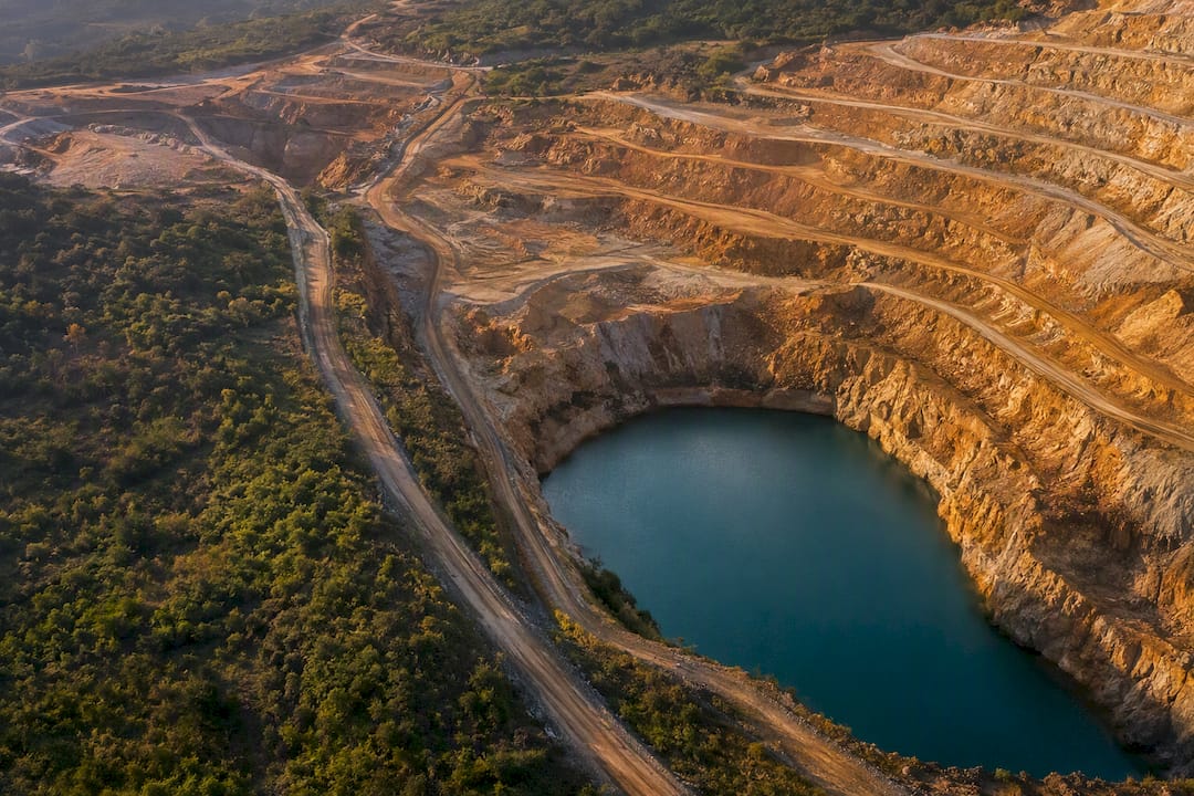 Terraced gold-mining landscape and water basin