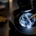 Laser-drilled diamond examined under microscope