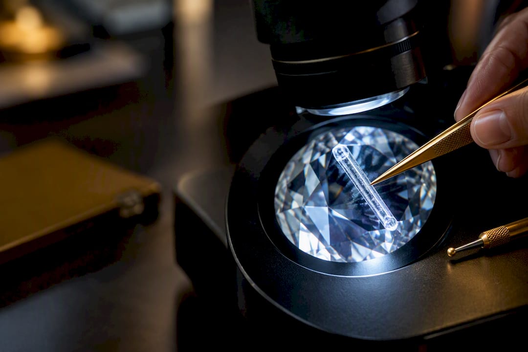 Laser-drilled diamond examined under microscope