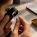 Loupe inspecting a diamond girdle inscription