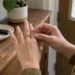 Hand testing silicone guard on spinning ring