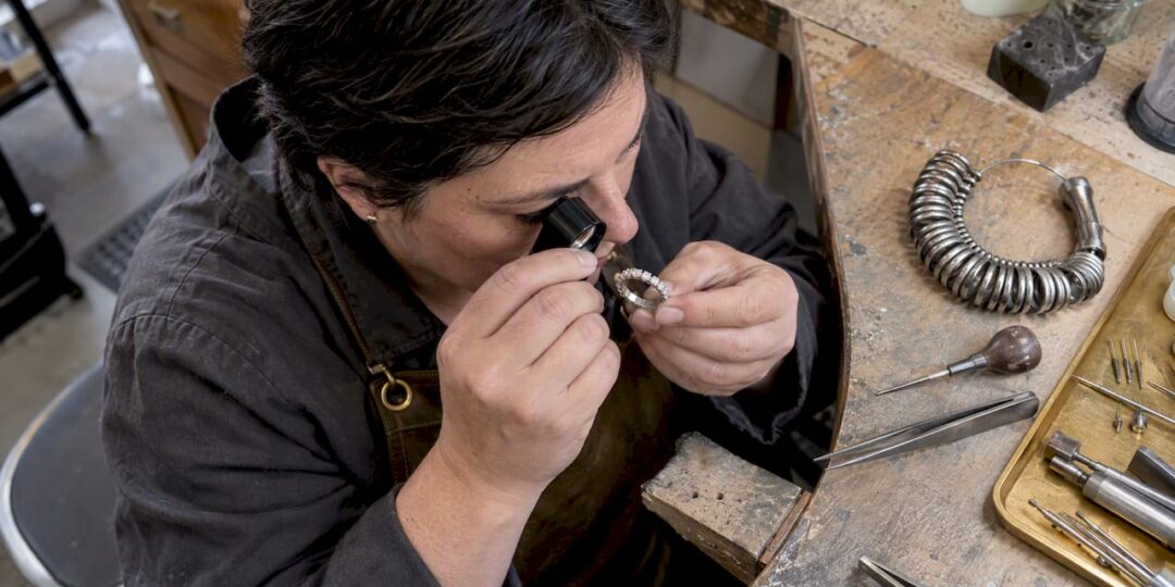 Jeweler inspecting a full eternity band