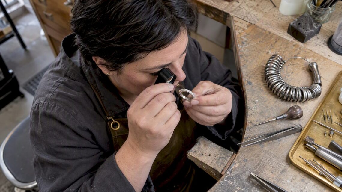 Jeweler inspecting a full eternity band