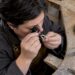 Jeweler inspecting a full eternity band