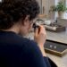 Buyer comparing two diamonds with a loupe
