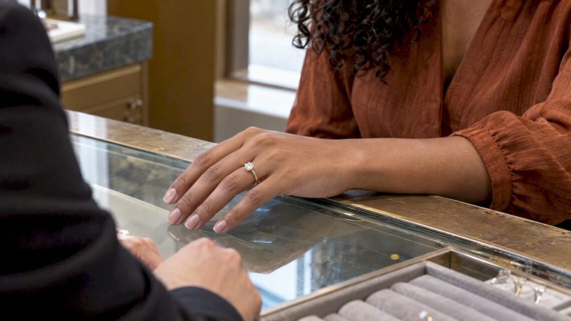 Solitaire diamond ring on a petite hand