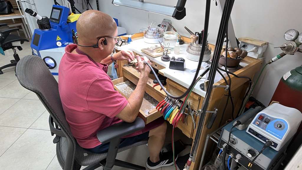 Custom jewelry design process at USA Jewels workshop
