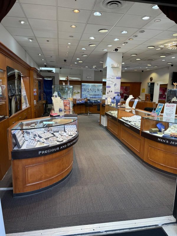 Wide view of USA Jewels showroom with precious gemstone displays