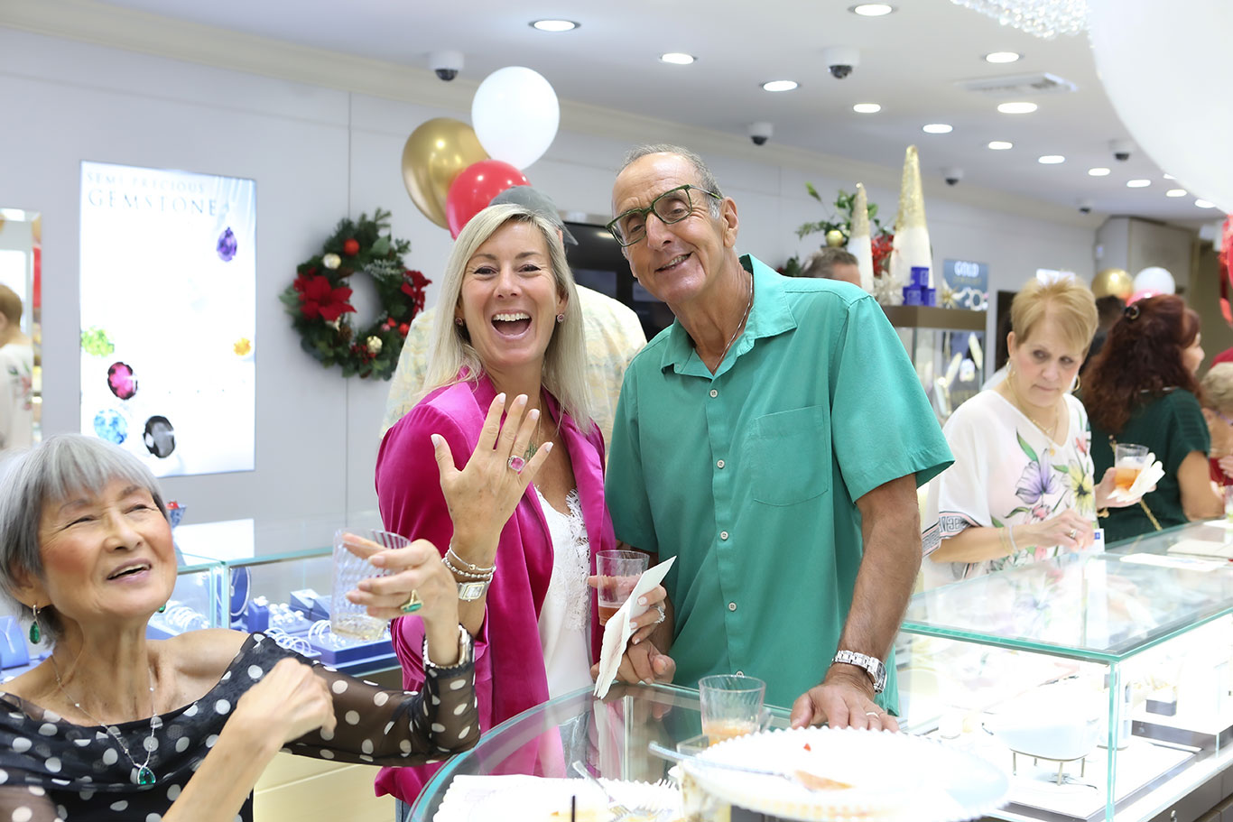 Happy customer showing off her new ring at USA Jewels holiday event