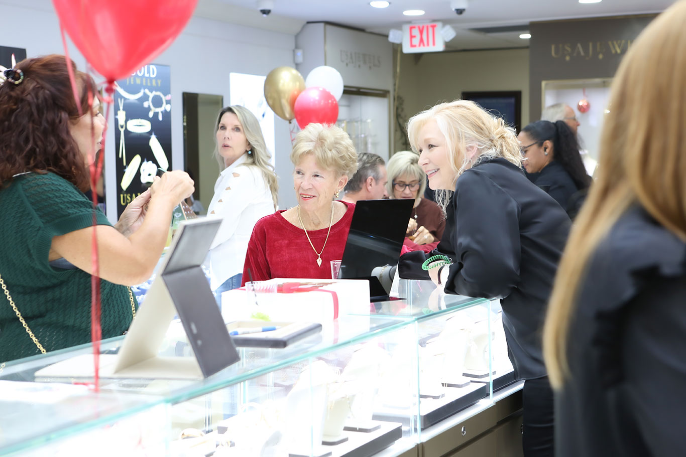 Customer enjoying food and drinks at jewelry store holiday celebration