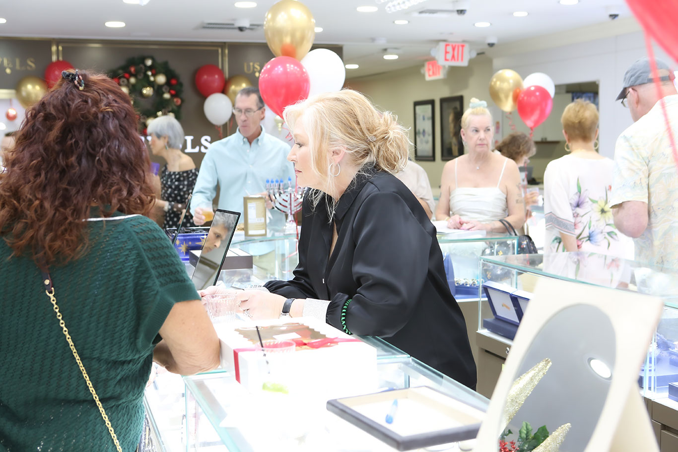 Team member helping customer during busy holiday evening