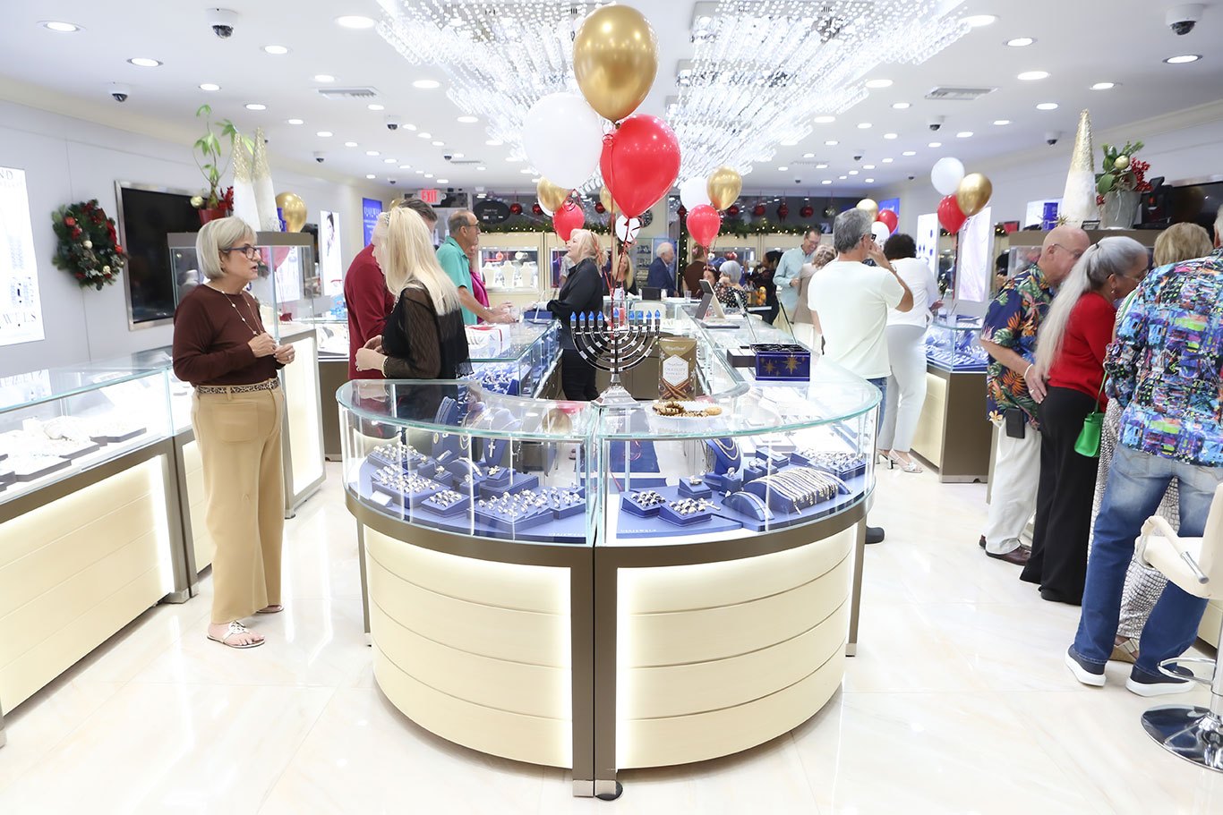 Guests enjoying the festive atmosphere at USA Jewels showroom