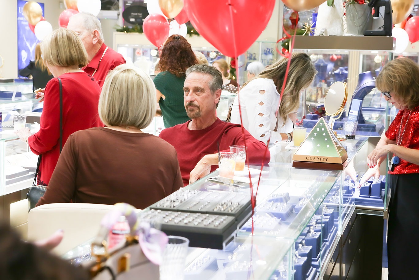 Busy showroom with customers browsing during USA Jewels holiday event
