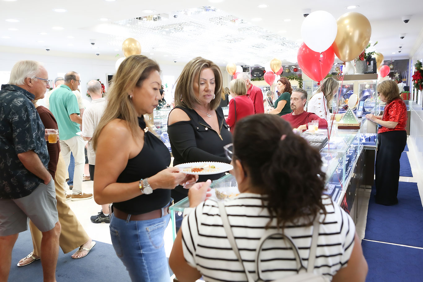 Alternate view of the busy showroom at USA Jewels holiday celebration