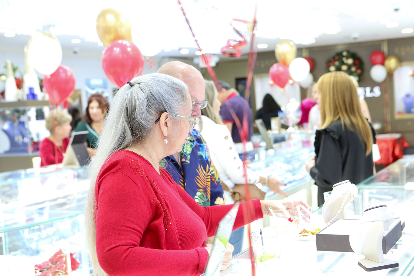 Customers browsing jewelry at the USA Jewels holiday event