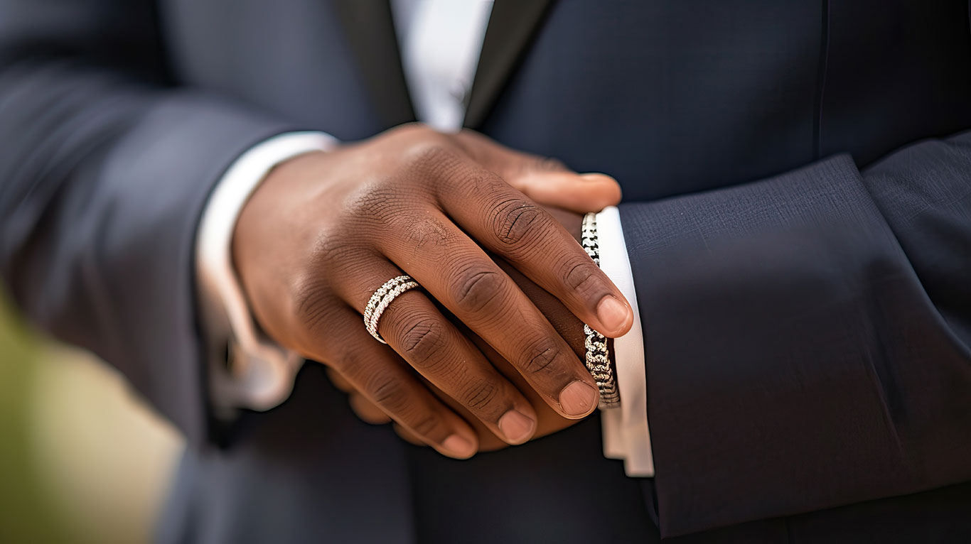 Men's wedding bands in gold, platinum, tungsten, and titanium featuring classic plain bands, brushed finish, and diamond accent styles